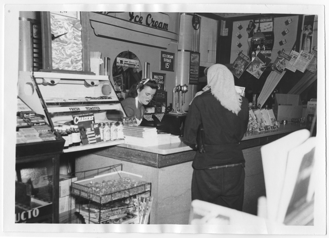 Flora Kite scoops ice cream at Jordan's, around 1940